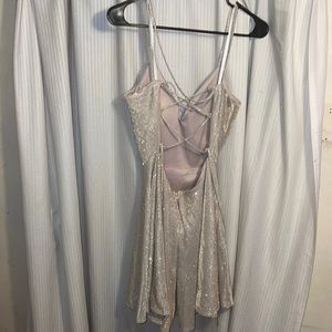 A glitter dress can’t really describe on what color it is very beautiful